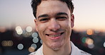 Face, happy and man in city at night for travel, tourism and confidence for holiday in town. Bokeh, portrait and person with smile, pride and laugh for vacation, weekend break and evening outdoor