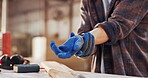 Carpentry, wrist pain or hands in warehouse with strain, muscle issue or overworked in building project. Accident, person or carpenter with discomfort, joint sprain or labor injury in woodworking.