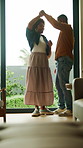 Happy, couple and spin in house with dance, embrace and connection for bonding together on weekend. Married, black people and hug in living room with love, romantic relationship and rhythm to music.