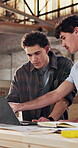 Carpentry, men and laptop with advice in workshop for CAD drawings, material selection or teamwork. Manufacturing, people and talk with tech for confirm design revision, quote preparation or planning