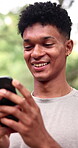 Happy man, laughing and phone in park with chat, comment or blog for comedy and internet. Person, social media and funny online post with mobile app outdoor, good mood and technology for connection