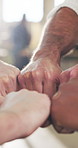 People, carpenter or hands with fist bump in workshop for collaboration, meeting or mission. Group, carpentry or employees with touch together in huddle, circle or solidarity for support or trust