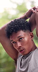 Man, outdoor and stretching for fitness, serious with workout and warm up for athlete training in park. Person, arm muscle resistance and start of exercise for health, sports and active in nature