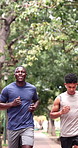 People, running and friends in park with fitness, endurance training and conversation for wellness. Runner, men and workout together outdoor with cardio challenge, discussion and advice for exercise.