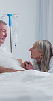 Old couple, holding hands and support in hospital room, talk or compassion for partner with illness. Healthcare, recovery and senior woman with spouse, discussion and empathy with gesture in clinic