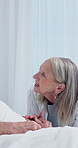 Old couple, holding hands and kiss in hospital, talking and comfort for senior partner with illness. Healthcare, recovery and elderly woman with spouse, happy and empathy with gesture in clinic