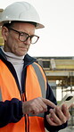 Phone, engineer and typing with man on construction site for architect, building or feedback. Communication, contractor and project manager with mature person outdoor for urban development update