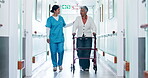 Walking, nurse and old woman in wheelchair at hospital for appointment, checkup and medical care. Healthcare, corridor and person with patient for assistance, help and support for consultation