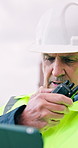 Engineer, radio and tablet at site for construction, research and discussion for architecture project. Mature man, talk or digital at worksite for inspection, progress report and building development