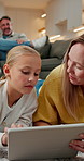 Mother, child or relax with tablet on carpet for playing online game, bonding activity and talking. Happy, mom or girl with tech in family home for solving digital puzzle, weekend break or connection