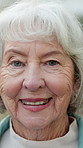 Face, elderly and woman outdoor in retirement, happy and wellness with positive attitude in old age. Female person, portrait and smile with pensioner, senior and good mood with wellbeing in nature