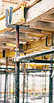Steel, construction and empty site with scaffolding for building, renovation or structure support. Beam, exterior framework and upgrade project for house extension, civil engineering and development