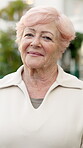 Face, senior and woman with smile in retirement, happy and wellness with positive attitude in old age. Female person, portrait and pensioner in good mood, wellbeing and elderly with calm outdoor
