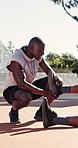 Man, fitness and player with ankle pain for medical assistance, help or stretching exercise. Active, male person or sport injury with sore foot, support or care for mistake, muscle tension or sprain