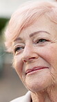 Thinking, happy and elderly woman outdoor with memory, daydreaming and nostalgia in calm mindset. Retirement, reflection and old person with smile, flashback and peaceful perspective in backyard.