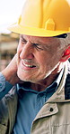 Construction, neck pain and mature man with massage, labor injury and joint issue on building site. Accident, fatigue or engineer with sprain, muscle strain or cervical tension in development project