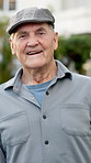 Face, senior and man with smile in retirement, happy and wellness with positive attitude in old age. Male person, portrait and pensioner in good mood, wellbeing and elderly with calm outdoor