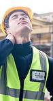 Construction, neck pain and man on site with massage, injury and joint issue in building project. Accident, fatigue and engineer outdoor with sprain, muscle strain and cervical tension in development