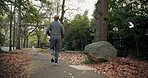 Fitness, training and man on road, running and endurance for physical activity or active for health. Outdoor, runner and mature person with energy for cardio, back and workout for wellness in city