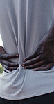Fitness, hands and massage back pain at park for muscle spasm, incorrect form or ligament sprain. Athlete, person and spine injury outdoor from poor exercise technique, discomfort and joint tension