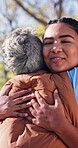 Volunteer, hug and smile with people outdoor for community service, team and ngo solidarity. Donation achievement, support and social responsibility with friends in nature for celebration and partner