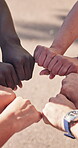 Motivation, support or people with group fist, outdoor solidarity or team building with unity. Diversity, above or friends with hands together, collaboration gesture or encouragement for milestone.