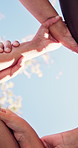 Circle, link and people holding arms for support, solidarity or bonding at nonprofit organization. Mockup space, team and group of volunteers with hands together for connection at NGO from below.