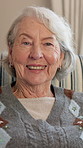 Face, smile and senior woman in home for self care, laugh and positive attitude on staycation. Portrait, relax and elderly person with happiness in living room, rest and retirement break in UK