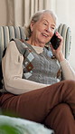 Gossip, conversation and old woman in living room with phone call, network or relax on weekend break. Happy, elderly person and discussion in house with mobile tech,  contact and internet connection.