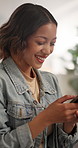 Laugh, happy and girl with phone on sofa for social media, online chat and funny meme on weekend. Relax, point and person on cellphone for message, internet joke and humor for communication in home