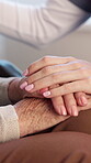 Healthcare, nurse and holding hands with old person in nursing home, help or compassion with gesture. Caregiver, trust and empathy for senior patient with disability, retirement and rehabilitation