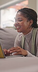 Remote work, home and woman with laptop, laughing or video editing project on website in living room. Creative, freelancer and happy person with technology, post production and funny reel in house