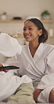 Makeup, help and laugh with women on sofa in home for beauty transformation, self care and spa day. Cosmetics, blush product and brush with friends in living room in apartment for glow and bonding