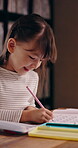 Homework, writing and smile with Japanese child in home for education, knowledge and math. Learning, study and notebook with kid in japan house for equations answer, student practice and solution