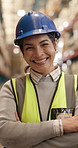 Face, confident or woman in warehouse as logistics manager with smile, distribution or supply chain. Portrait, arms crossed or happy person in shipping industry, quality control or safety with helmet