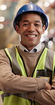 Face, arms crossed and man in warehouse as logistics worker with smile, distribution or supply chain. Portrait, confidence or happy person in shipping industry, quality control or safety with helmet