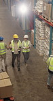 Above, people and tablet at warehouse for logistics, inspection and stock check for shipping. Team, walking and talking at depot with digital, inventory checklist and quality control for distribution