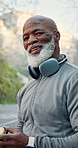 Drinking water, face and fitness with black man outdoor for cardio training or workout activity. Exercise, happy and hydration with mature person in nature for recovery, refreshment or sports