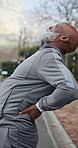 Fitness, injury and black man with back pain outdoor for exercise, health or active morning. Sports, arthritis and mature person with muscle sprain, fibromyalgia or inflammation for workout in nature