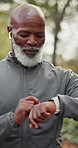 Face, black man and smart watch in park for fitness, progress and heart rate from exercise. Portrait, mature person or smile in nature with tech, tracking health and notification for sports stats