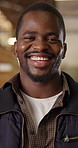 Carpentry, face or black man in factory with laugh, handyman or about us in manufacturing industry. Happy, bokeh and artisan with joke reaction, production career and confidence in woodworking.
