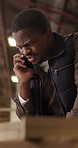 Carpenter, phone call and man in workshop, talking or communication with contact for project update. Warehouse, woodworking and black person with mobile, discussion and plan for furniture production