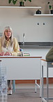 Teacher, talking and classroom for lesson, college education and learning for development in school. University, teaching and lecturer or mature woman with students for writing attendance register 