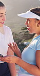 Outdoor, fitness and woman with conversation, phone and tips for tennis competition. People, wellness center and friends with tech for advice, help and discussion for technique or game training