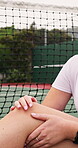 Tennis, injury and woman with knee pain on court, muscle tension and massage for relief. Sports, accident or inflammation with athlete hands, bruise or joint ache with pressure, health and outdoor