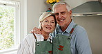 Face, smile and old couple in home for cooking, hug and laughing with partner for support. Meal prep, man and woman with apron in kitchen with happiness, embrace or love with portrait in retirement