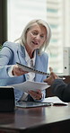 Businesswoman, talk and consultation in office with paperwork, finance advice or proposal for budget. Mature person, financial advisor and chat in meeting with documents, cost control plan or insight