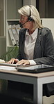Call center, headset or woman in office with computer, crm service or investment advice at night. Talking, guidance or mature finance advisor with mic, online banking or contact us in evening shift.