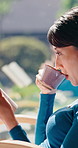 Relax, reading book and Asian woman with coffee in home, fiction story or info on weekend. Japanese person, drink or novel in house for fantasy, peace or literature hobby with chapter by window