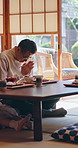 Asian man, prayer and bow at house with food, traditional greeting and gratitude for lunch meal. Family, child or blessing in living room with appreciation, buffet feast and authentic Chinese cuisine